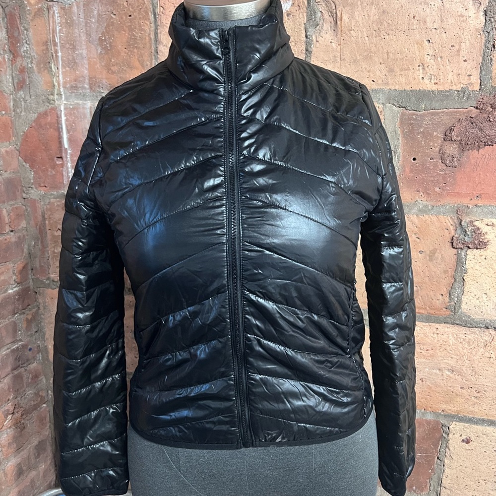 Brand New, Never Worn lightweight Black puffer jacket.